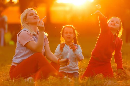 Summer fun. little girls play in the field