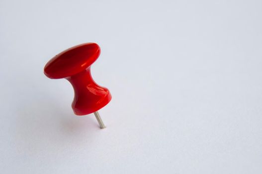 Red push pins isolated on white background. Copy space