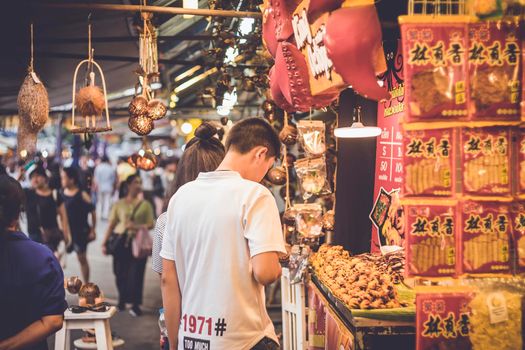 October  2019 Bangkok Thailand food vendor at Chatuchak weekend market in Bangkok, Thailand. It is the largest market in Thailand.  Tourists are shopping