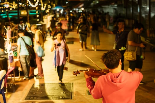 November 2020 Bangkok Thailand, Musicial playing  at Ongang canal street art.