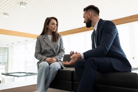 a lawyer communicates with his client before starting a court case.