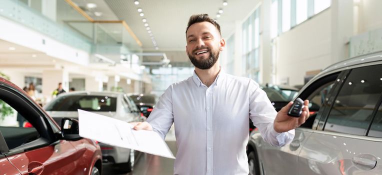 an employee of an insurance company draws up an insurance policy when buying a new car in a car dealership.