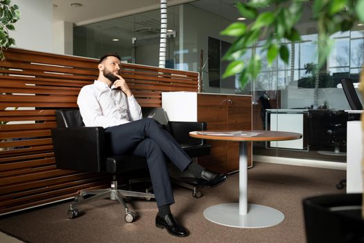 a man waiting in line for a job interview dreams of career success.