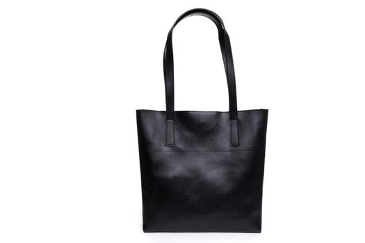 stylish black women's bag made of genuine leather with a handle.