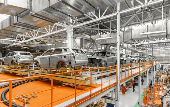 Automobile production line. Welding car body. Modern car assembly plant.