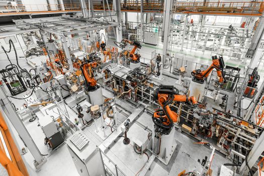 Automobile production line. Welding car body. Modern car assembly plant. Top view.