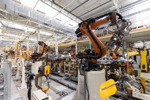 Plant for production of cars. Modern automotive industry. Electric car factory, conveyor.