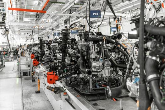 Photo of automobile production line. Welding car body. Modern car assembly plant. Auto industry. Interior of a high-tech factory, modern production.