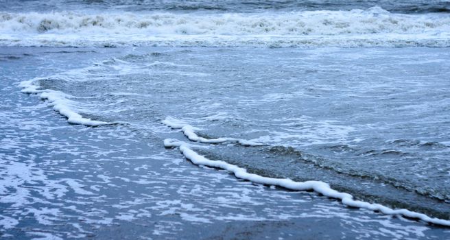 Blue Sea waves flowing on ocean floor. Full frame. Nature background.