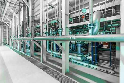 Photo of pipes and tanks. Chemistry and medicine production. Pharmaceutical factory. Interior of a high-tech factory, modern production.