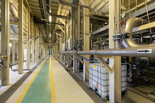 Photo of pipes and tanks. Chemistry and medicine production. Pharmaceutical factory. Interior of a high-tech factory, modern production.