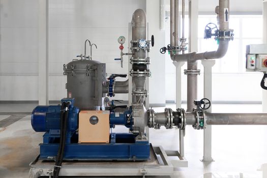 Closeup photo of pipes and tanks. Chemistry and medicine production. Pharmaceutical factory.