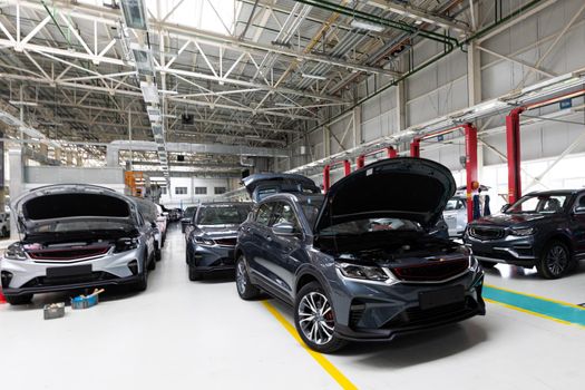 Modern car assembly plant. Auto industry. Interior of a high-tech factory, modern production of automobiles.