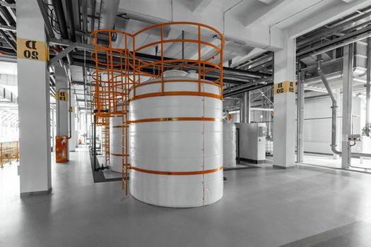 Photo of pipes and tanks. Chemistry and medicine production. Pharmaceutical factory.