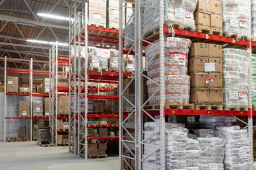 warehouse automated logistics center with red racks.