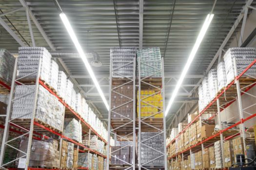 panoramic photo of an automated warehouse logistics center with high-bay shelving.