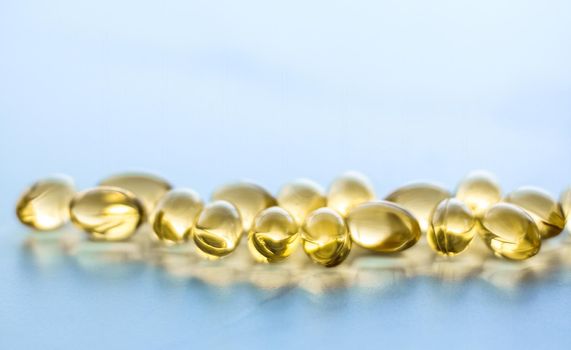 Pharmaceutical, branding and science concept - Vitamin D and golden Omega 3 pills for healthy diet nutrition, fish oil food supplement pill capsules, healthcare and medicine as pharmacy background