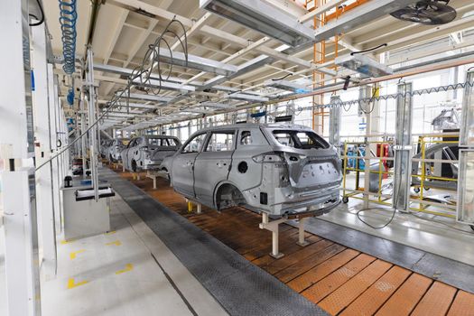 Plant for production of cars. Modern automotive industry. Electric car factory, conveyor.