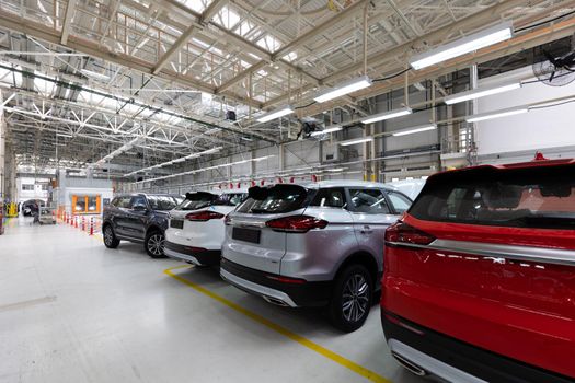 Modern car assembly plant. Auto industry. Interior of a high-tech factory, modern production.