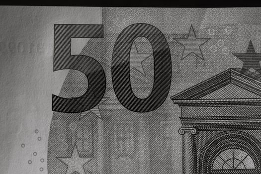 Selective focus on detail of euro banknotes. Close up macro detail of money banknotes, 50 euro isolated. World money concept, inflation and economy concept