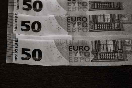 Selective focus on detail of euro banknotes. Close up macro detail of money banknotes, 50 euro isolated. World money concept, inflation and economy concept