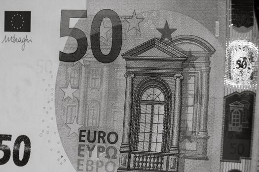 Selective focus on detail of euro banknotes. Close up macro detail of money banknotes, 50 euro isolated. World money concept, inflation and economy concept