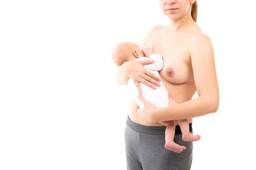 young mother on a white background breastfeeds her baby.
