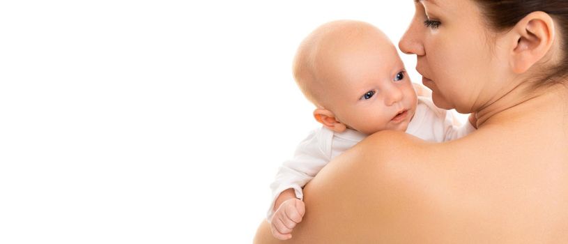 A curious baby looks over the shoulder of a mother, learns a new world.