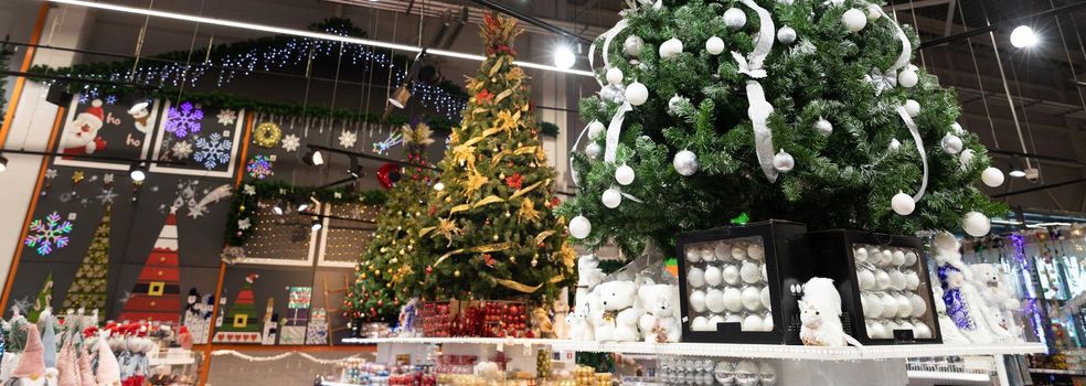 New Year's goods in the hypermarket, Christmas tree and Christmas decorations, Christmas goods.