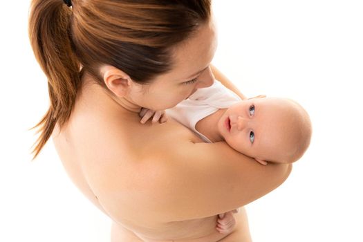 a newborn baby in the arms of a caring mother, tenderness and caring for a small child.