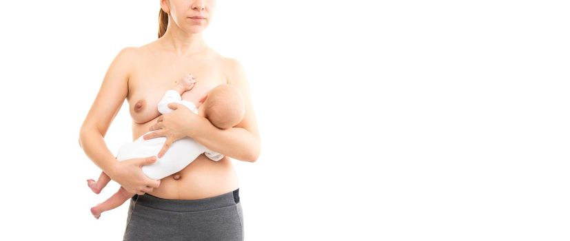young woman breastfeeding baby on white background, half-length shot.