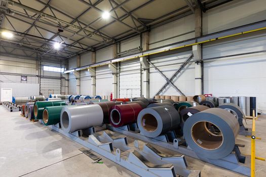 Photo shot of rolls of steel sheet stored in warehouse; Cold rolled steel coils at the factory.