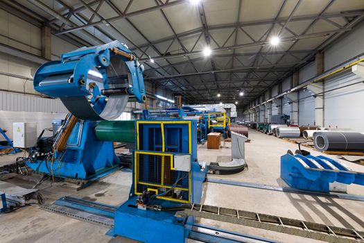 Photo shot of rolls of steel sheet stored in warehouse; Cold rolled steel coils at the factory.