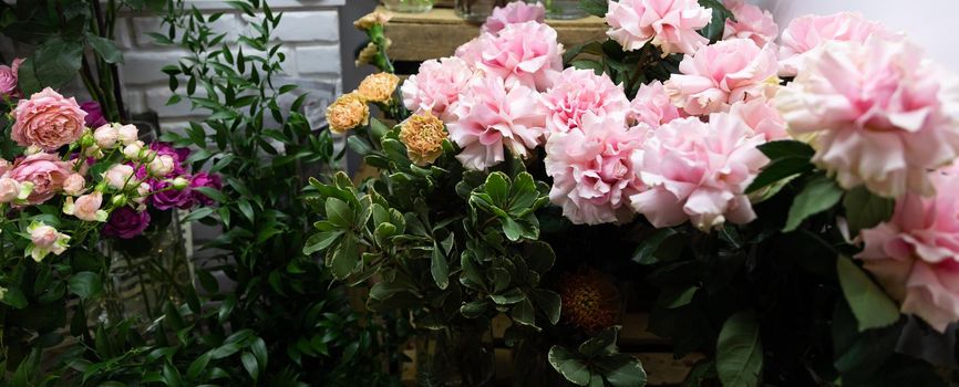 fresh cut roses in delicate tones in a flower shop.