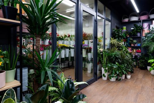 shop window with a refrigerator selling natural flowers