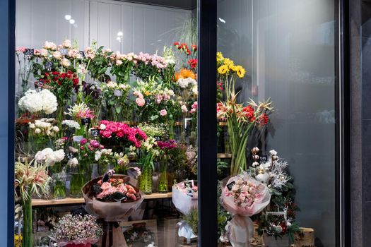 fridge in premium flower shop with bouquets and stylish flower arrangements.