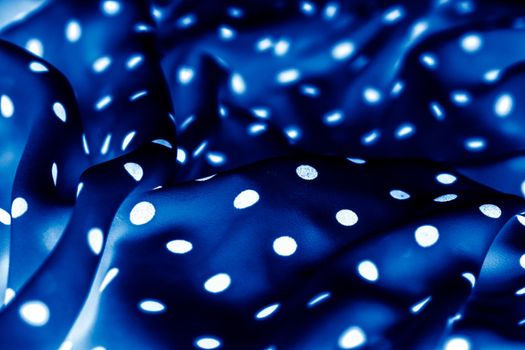 Fashion design, interior decor and vintage material concept - Classic polka dot textile background texture, white dots on blue luxury fabric design pattern