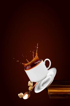 Falling coffee cup. Cup of coffee splashes while falling. Splash in white coffee cup. Hot beverage splashing, food levitation