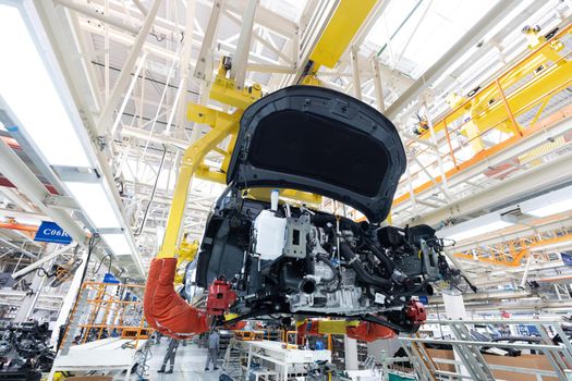 Automobile production line. Welding car body. Modern car assembly plant. Auto industry. Interior of a high-tech factory, modern production.