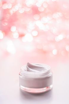 Cosmetic branding, gift and spa concept - Facial cream moisturizer jar on holiday glitter background, moisturizing skin care as lifting emulsion, anti-age cosmetics for luxury beauty skincare brand