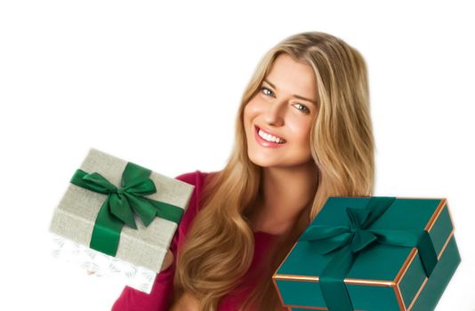 Christmas gifts and holiday presents, happy woman holding gift boxes isolated on white background, portrait