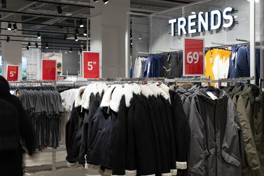 interior of a large store selling jeans and jackets.