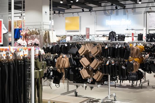 interior of a large store selling clutch bags and leather accessories.