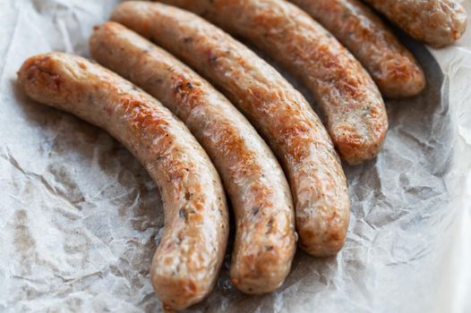 Grilled sausages with sauce and vegetables. Summer rest concept