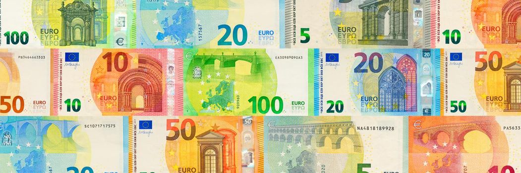 Euro banknotes creative layout. Background from European banknotes, euro. euro money of different denominations abstract background