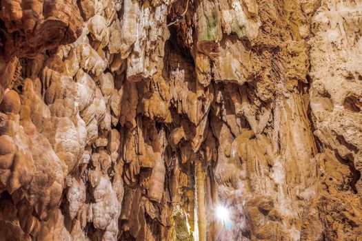 Limestone stalactites mineral formation hanging from the ceiling inside a cave in Edessa, Greece.