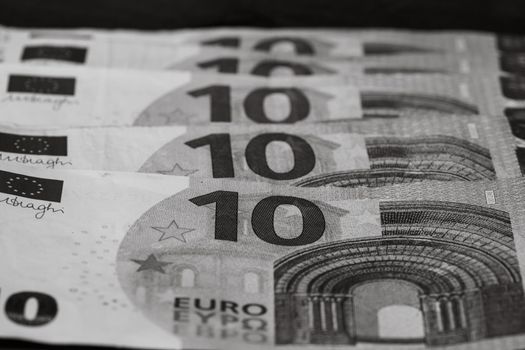 Selective focus on detail of euro banknotes. Close up macro detail of money banknotes, 10 euro isolated. World money concept, inflation and economy concept