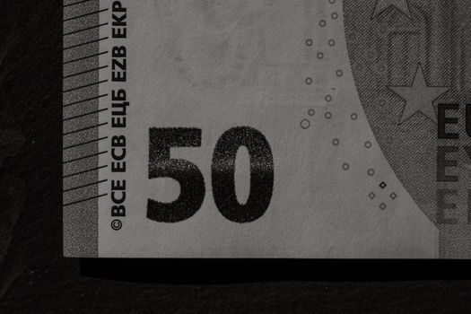 Selective focus on detail of euro banknotes. Close up macro detail of money banknotes, 50 euro isolated. World money concept, inflation and economy concept