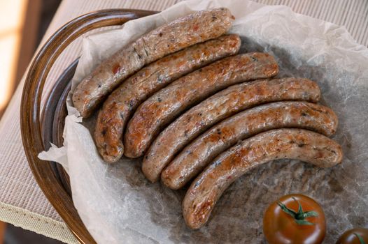 Grilled sausages with sauce and vegetables. Summer rest concept