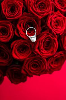 Gemstone jewellery, wedding present and engagement proposal concept - Beautiful white gold pearl ring and bouquet of red roses, luxury jewelry love gift on Valentines Day and romantic holidays